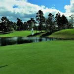 Panoramic view of a lush green golf course at Arkansas Golf Trail. Smooth