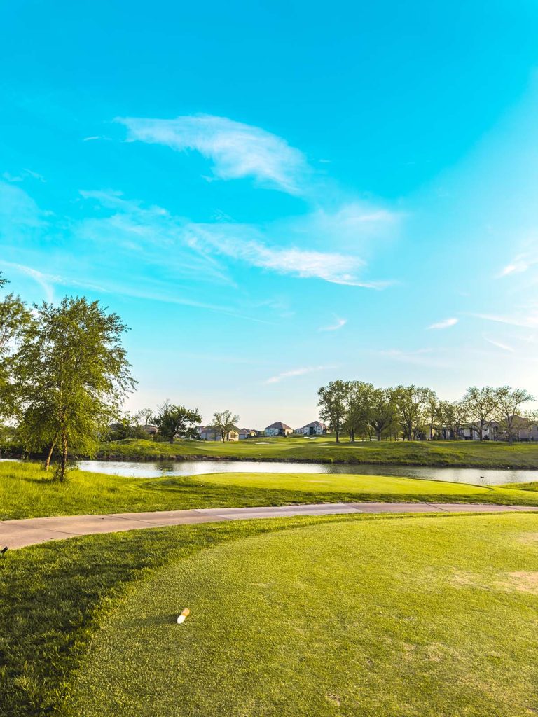 Panoramic view of a lush green golf course at Balboa Golf Course. Smooth