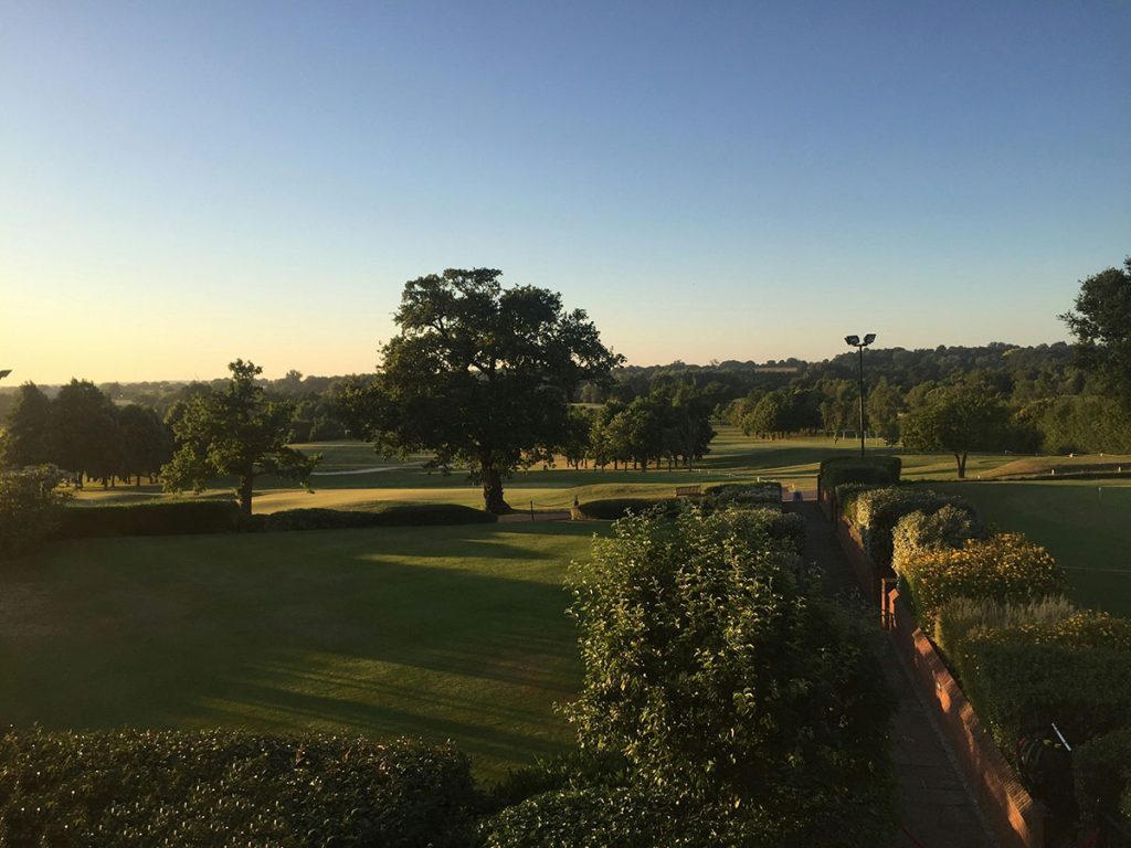 Panoramic view of a lush green golf course at Baldwin Golf Course. Smooth