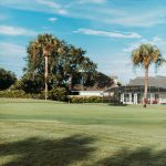 Panoramic view of a lush green golf course at Birchwood Country Club. Smooth