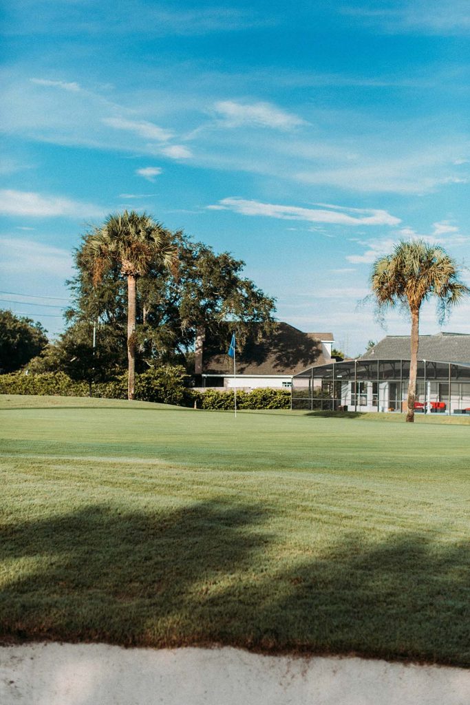 Panoramic view of a lush green golf course at Birchwood Country Club. Smooth