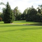 Panoramic view of a lush green golf course at Bolingbrook Golf Club. Smooth