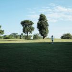 Panoramic view of a lush green golf course at Bunker Links Municipal Golf. Smooth