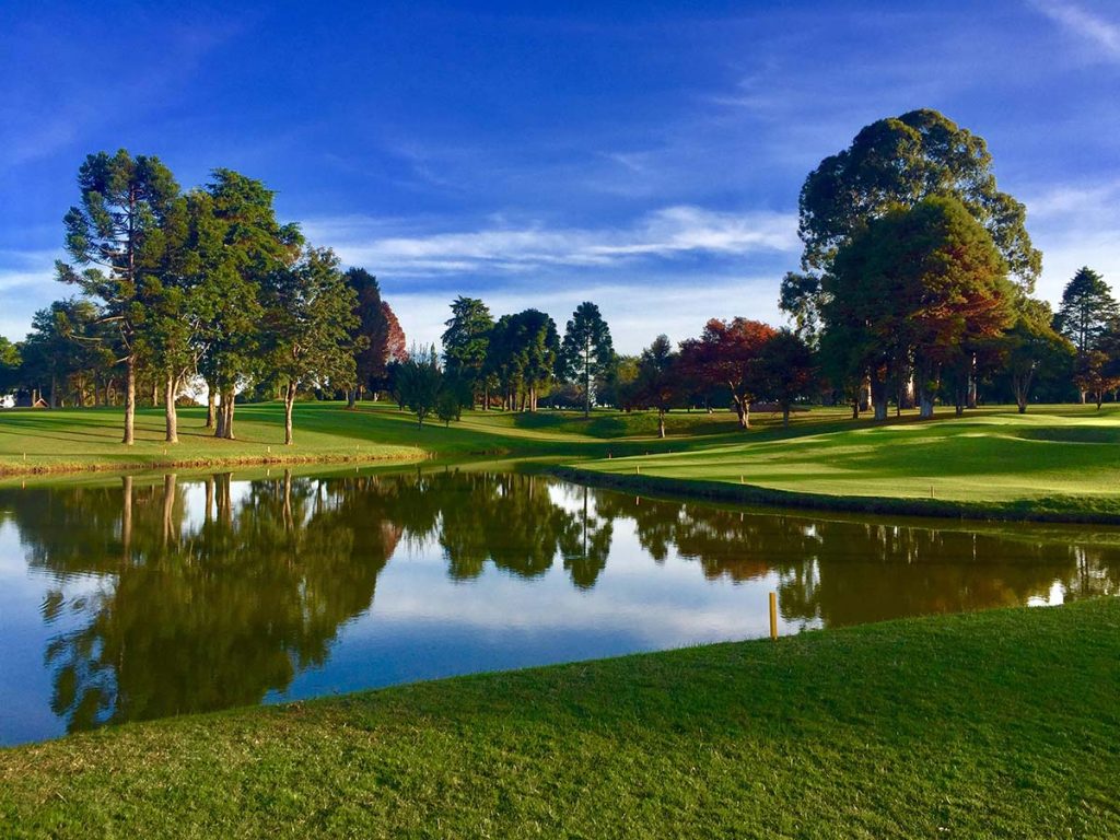 Panoramic view of a lush green golf course at Carroll County Golf Course. Smooth