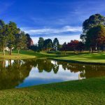 Panoramic view of a lush green golf course at Carroll County Golf Course. Smooth