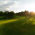 Panoramic view of a lush green golf course at Centennial Valley Golf. Smooth