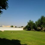 Panoramic view of a lush green golf course at Deer Valley Golf Club. Smooth