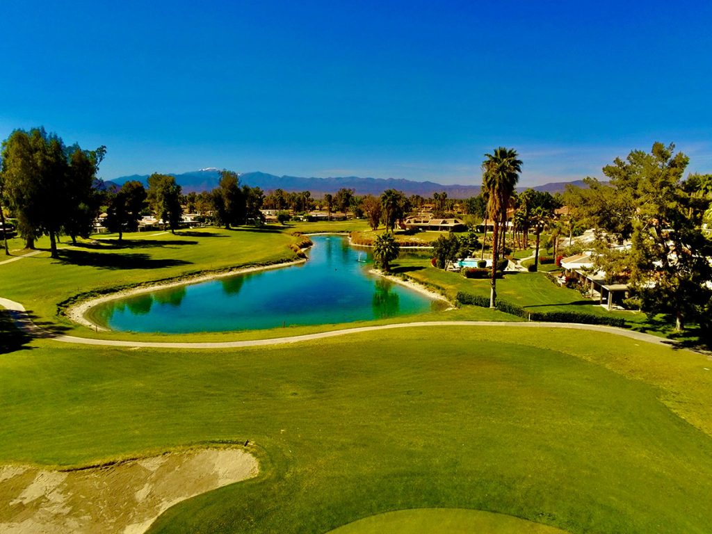 Panoramic view of a lush green golf course at Esplanade Golf and Country Club at Lakewood Ranch (Members Only). Smooth