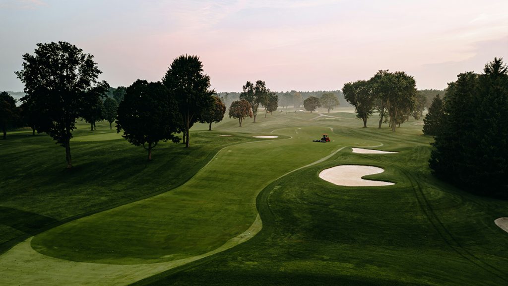 Panoramic view of a lush green golf course at Falcon Lakes. Smooth