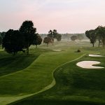 Panoramic view of a lush green golf course at Falcon Lakes. Smooth