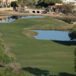 Panoramic view of a lush green golf course at First Tee - Northwest Arkansas. Smooth