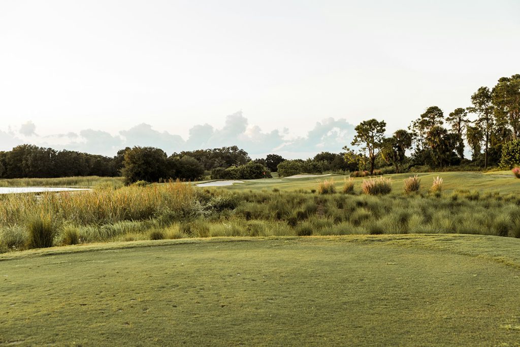 Panoramic view of a lush green golf course at Golf Ranch Brookfield. Smooth