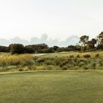 Panoramic view of a lush green golf course at Golf Ranch Brookfield. Smooth