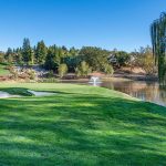 Panoramic view of a lush green golf course at Greens of Manatee Golf Course. Smooth