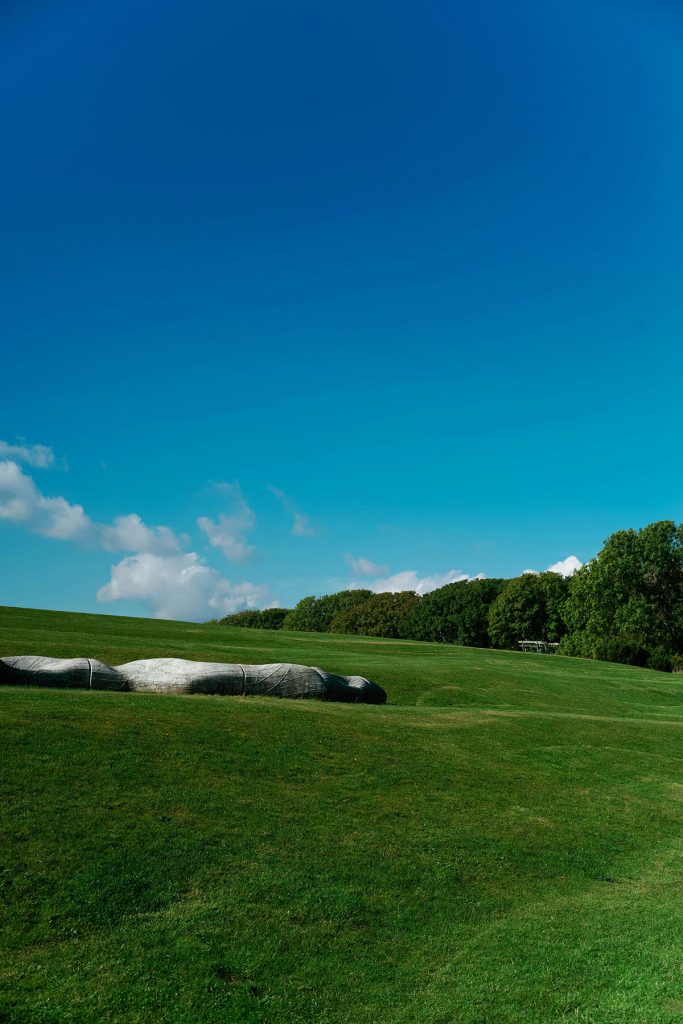 Panoramic view of a lush green golf course at Hayden Lake Country Club. Smooth