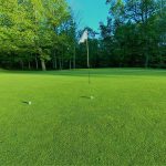 Panoramic view of a lush green golf course at Heritage Eagle Bend Golf Club. Smooth