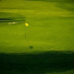 Panoramic view of a lush green golf course at Indian Creek Golf Club. Smooth