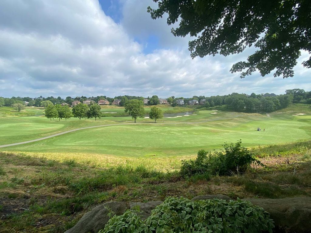Panoramic view of a lush green golf course at Ironwood Golf Club. Smooth