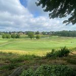 Panoramic view of a lush green golf course at Ironwood Golf Club. Smooth