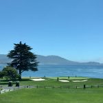 Panoramic view of a lush green golf course at Isla Del Sol Yacht & Country Club. Smooth