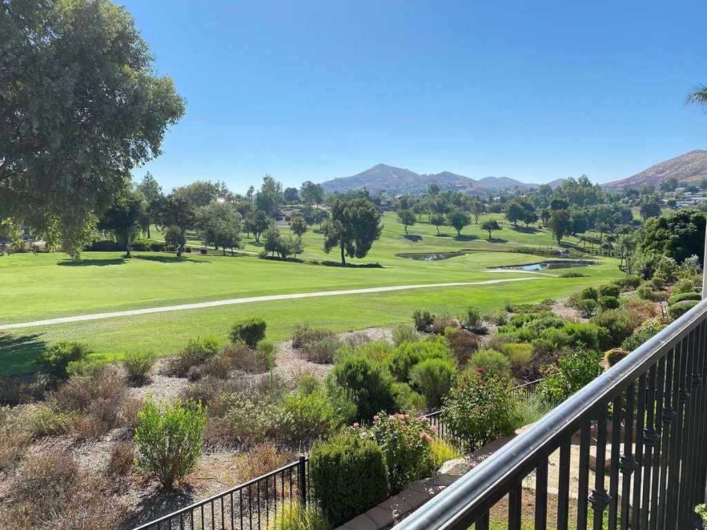 Panoramic view of a lush green golf course at Northwestern Hills Golf Course. Smooth