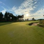 Panoramic view of a lush green golf course at Old Overton Club. Smooth