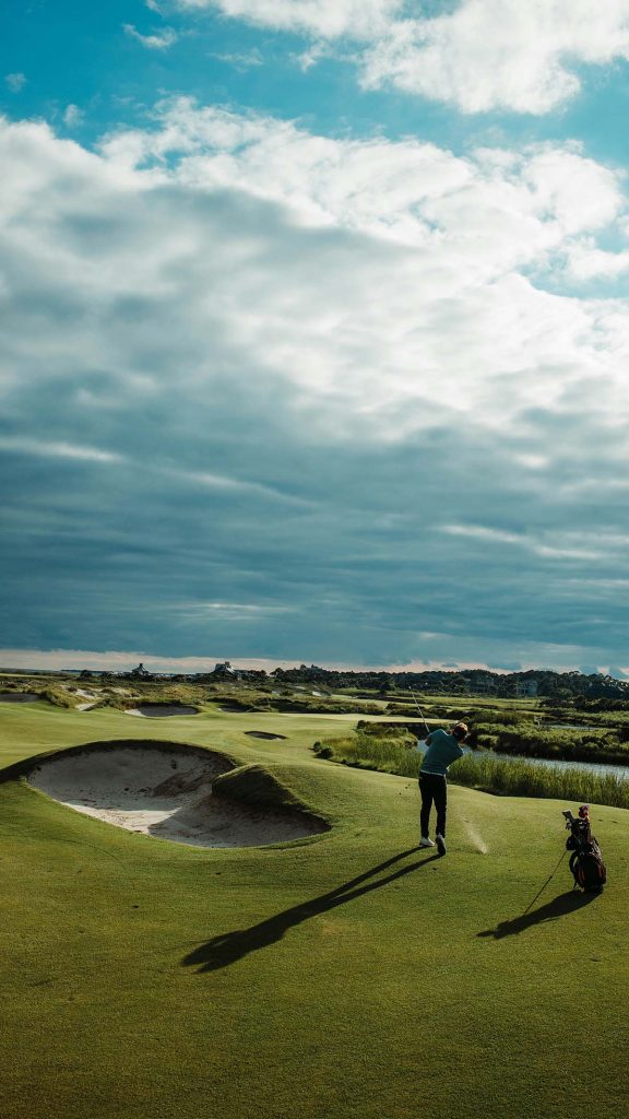 Panoramic view of a lush green golf course at Osprey Cove. Smooth