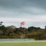Panoramic view of a lush green golf course at Oxford Greens. Smooth