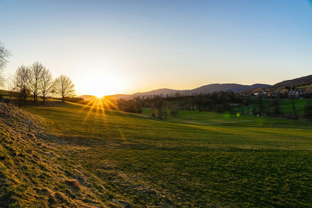 Panoramic view of a lush green golf course at Squire Creek Country Club. Smooth