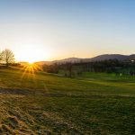 Panoramic view of a lush green golf course at Squire Creek Country Club. Smooth