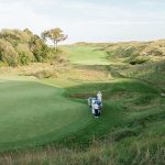 Panoramic view of a lush green golf course at Stonebridge Golf Club of New Orleans. Smooth