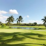Panoramic view of a lush green golf course at Talons Of Tuscany Golf Club. Smooth