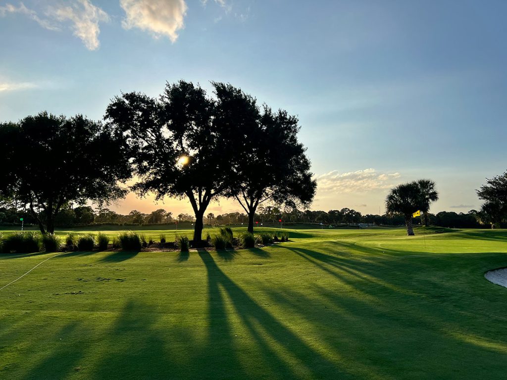 Panoramic view of a lush green golf course at The Country Club at The Golden Nugget. Smooth