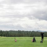 Panoramic view of a lush green golf course at The Links Golf Course. Smooth