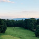 Panoramic view of a lush green golf course at The Players Club at Woodland Trails. Smooth