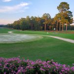 Panoramic view of a lush green golf course at Trumann Country Club. Smooth
