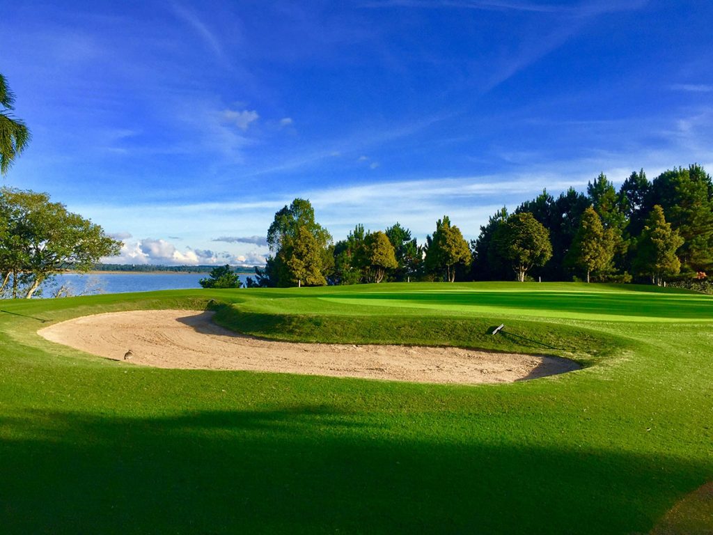 Panoramic view of a lush green golf course at Twin Lakes Golf Course LLC. Smooth