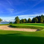 Panoramic view of a lush green golf course at Twin Lakes Golf Course LLC. Smooth