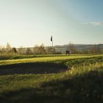 Panoramic view of a lush green golf course at Whitetail. Smooth