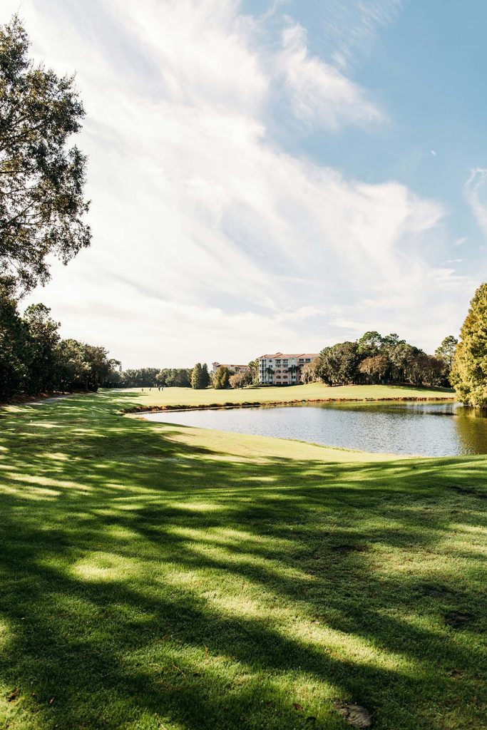 Panoramic view of a lush green golf course at Wilmington Country Club. Smooth