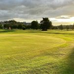 Panoramic view of a lush green golf course at Wynlakes Golf & Country Club. Smooth