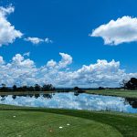 Panoramic view of a lush green golf course at York Golf & Tennis Club. Smooth