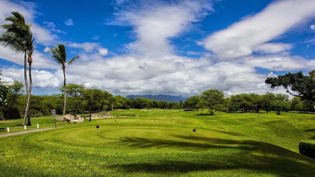 Panoramic view of a lush green golf course at 360 Ewa Beach Country Club. Smooth
