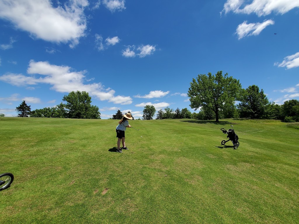 Panoramic view of a lush green golf course at A. L. Gustin Golf Course. Smooth