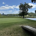 Panoramic view of a lush green golf course at A.J. Jolly Golf Course. Smooth