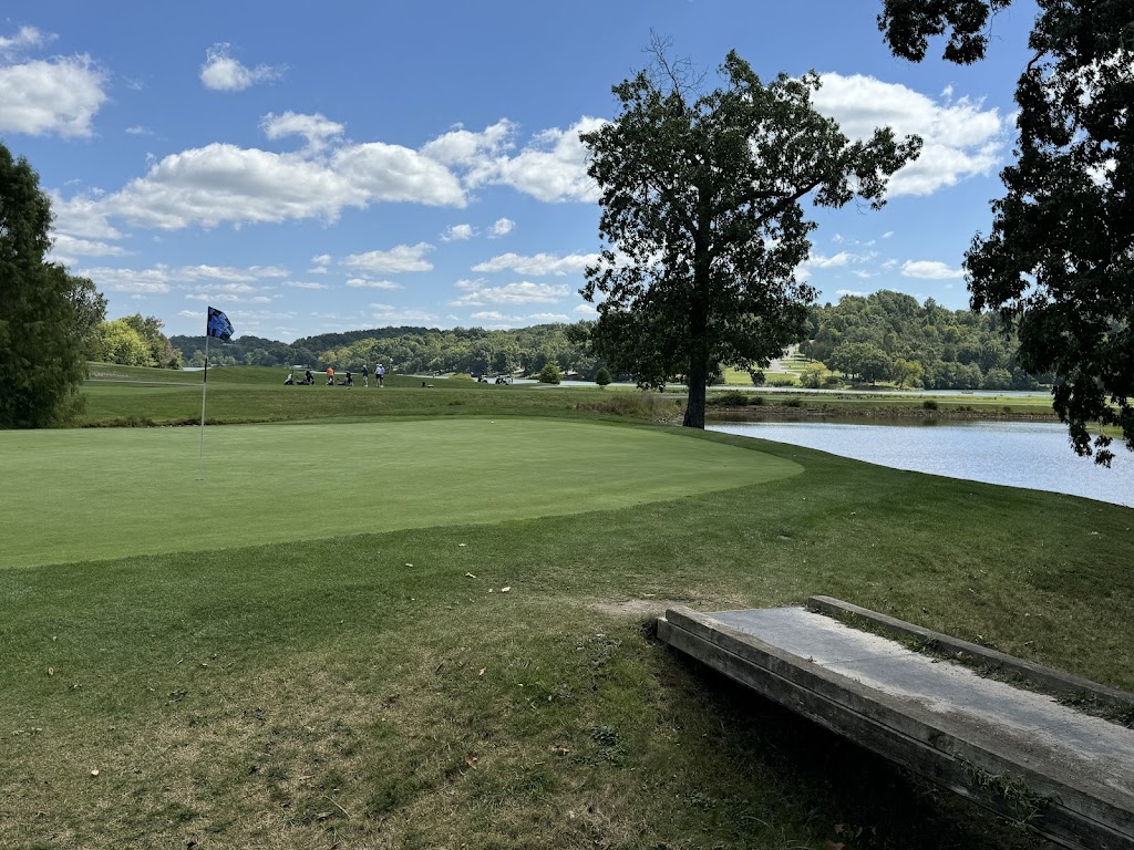 Panoramic view of a lush green golf course at A.J. Jolly Golf Course. Smooth