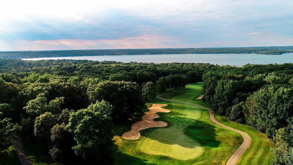 Panoramic view of a lush green golf course at Abbey Springs. Smooth