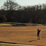 green grass with the flag in the hole.