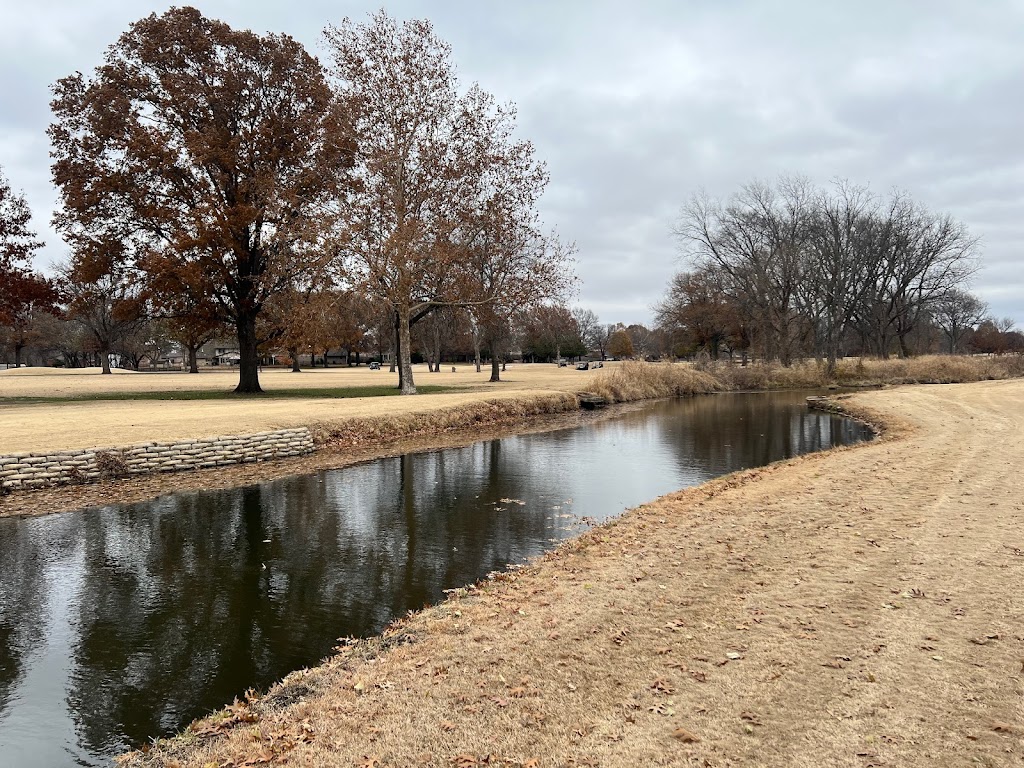 Panoramic view of a lush green golf course at Adams Municipal Golf Course. Smooth