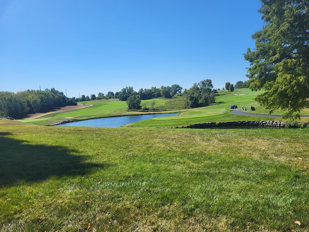 Panoramic view of a lush green golf course at Adams Pointe Golf Club. Smooth